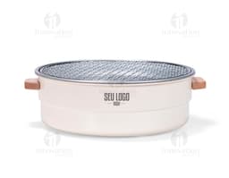 Shiny silver metal portable grill, close-up kitchen equipment. Ideal for preparing food while enjoying the outdoors or in a
