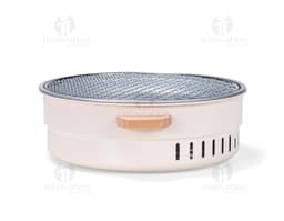 Shiny silver metal portable grill, close-up kitchen equipment. Ideal for preparing food while enjoying the outdoors or in a