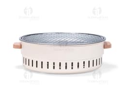 Shiny silver metal portable grill, close-up kitchen equipment. Ideal for preparing food while enjoying the outdoors or in a