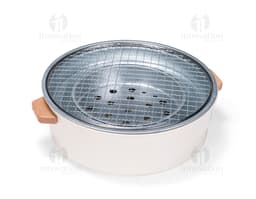 Shiny silver metal portable grill, close-up kitchen equipment. Ideal for preparing food while enjoying the outdoors or in a