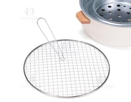 Shiny silver metal portable grill, close-up kitchen equipment. Ideal for preparing food while enjoying the outdoors or in a