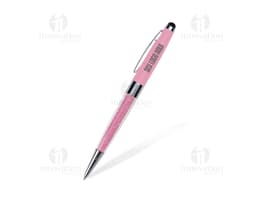 Caneta metal touch preta e prateada em um papel preto, próxima a um lápis e a um papel em branco.