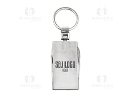Photo of a keychain multi-tool with 4 functions, a metal object with various utilities, including closure, protection, and