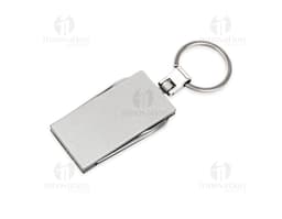 Photo of a keychain multi-tool with 4 functions, a metal object with various utilities, including closure, protection, and