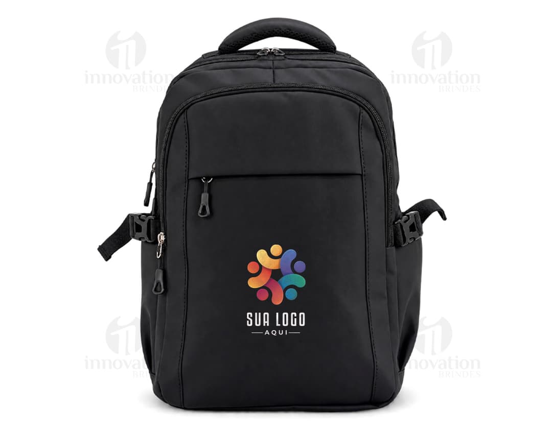 Black leather backpack and fanny pack, ideal for travel, business, and leisure. A suited man holds the backpack's handle