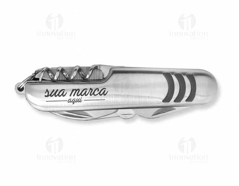 Imagem de um canivete 5 funções em aço inoxidável com lâmina afiada e acabamento cromado. Ideal para uso em ambientes corporativos ou em atividades ao ar livre. Prático, seguro e versátil, este canivete é indispensável para quem busca qualidade e tecnologia em um único produto. Adquira já o seu!