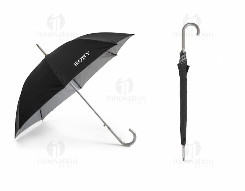 Guarda-chuva preto de nylon com design inovador. Proteção contra a chuva e o sol. Acessório essencial para o dia a dia! Compre já o seu no nosso site de brindes. #guardachuva #proteçãocontraachuva #acessório #brindes #ecommerce