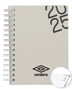 Agenda diária 2025 Wire-o com capa dura na cor preta e detalhes em dourado, apresentando páginas internas decoradas com linhas para anotações diárias.