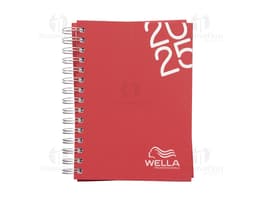 Agenda diária 2025 Wire-o com capa dura na cor preta e detalhes em dourado, apresentando páginas internas decoradas com