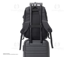 Synthetic leather laptop backpack, perfect for business or leisure travel. Modern and spacious, with a padded compartment to
