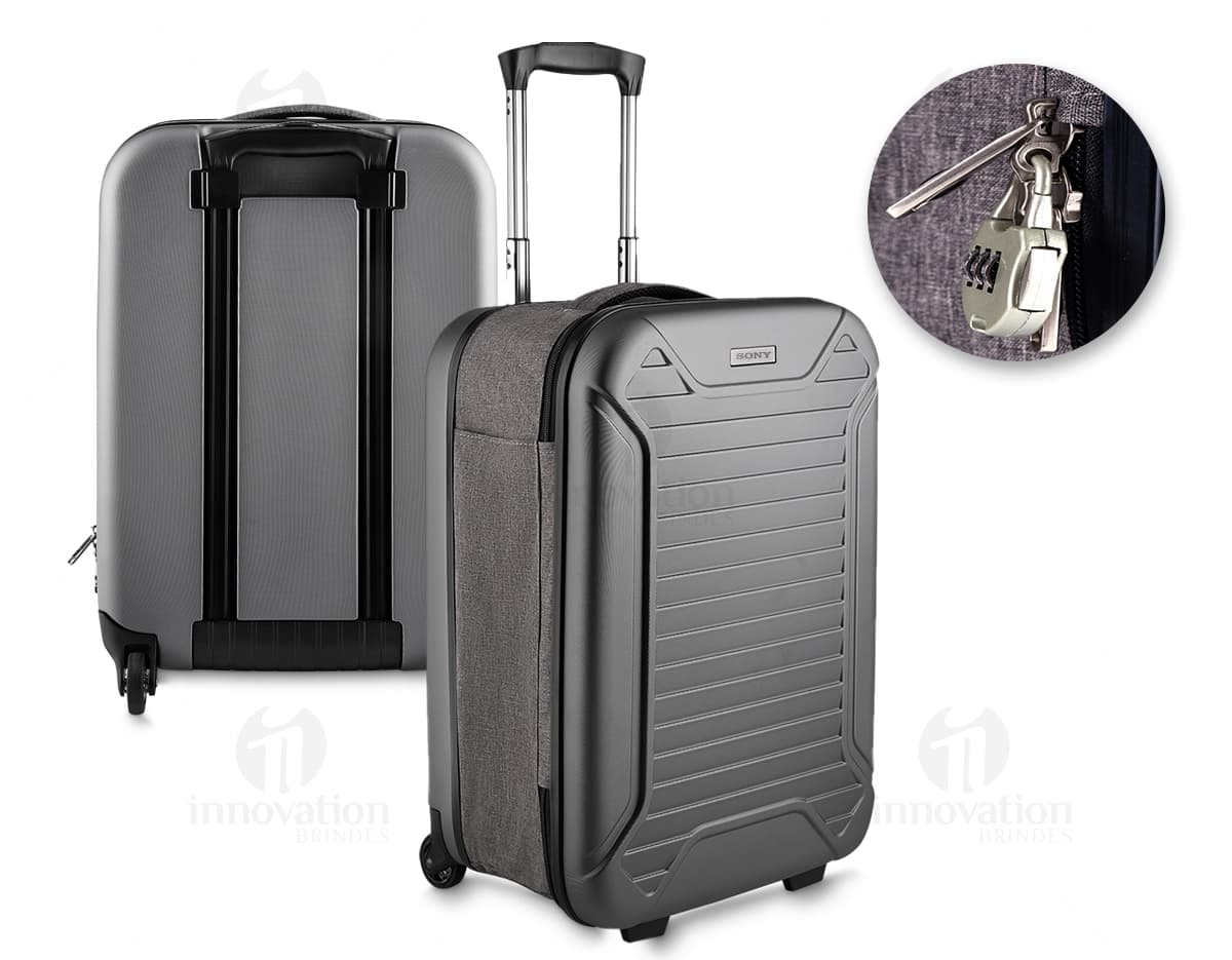 Mala de viagem pequena de tecido lateral em ABS, preta e moderna. Contém equipamentos eletrônicos e de áudio no interior, com design vintage e fecho de metal. Ideal para viagens de negócios ou lazer.