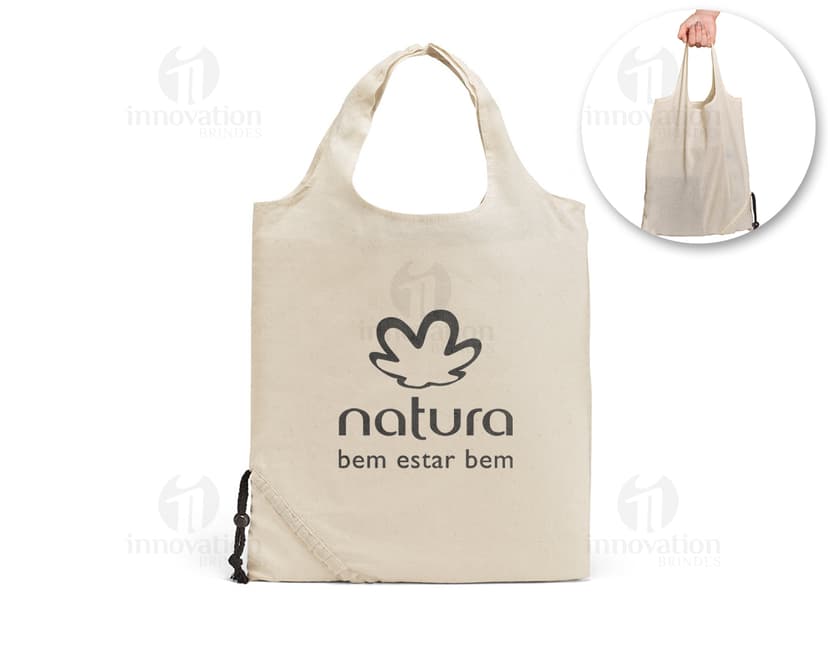 Bolsa de compras de algodão marrom vazia, dobrável e durável, com alça de couro e fecho de metal. Perfeita para compras, presente ou uso diário.