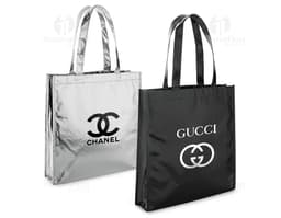 Luxury brown leather tote bag measuring 340 x 350 mm, featuring metal details and a combination lock for added security. The