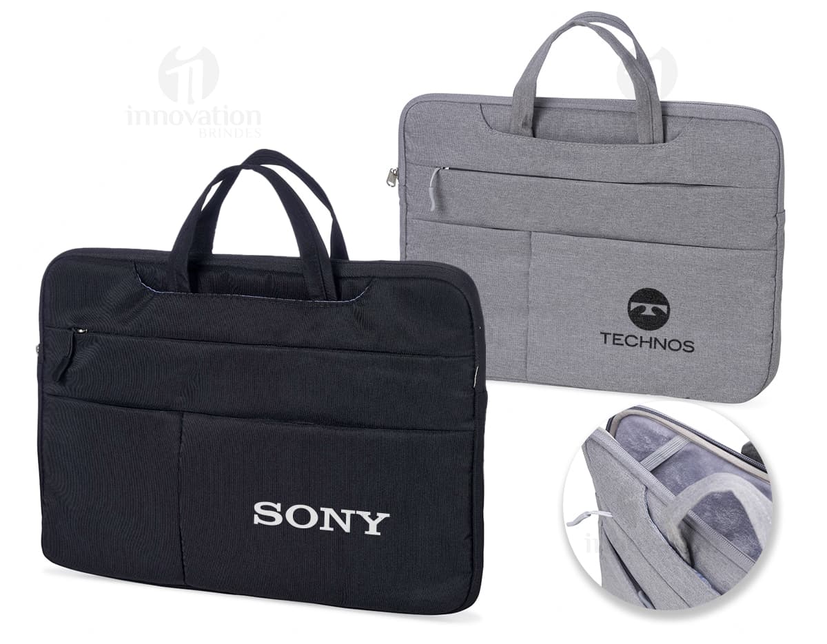 Pasta preta de couro para notebook de 15 polegadas, ideal para uso empresarial e viagens. Design elegante e moderno, com fecho de metal, alça de mão e alças ajustáveis para as costas. Perfeita para transportar seu dispositivo com segurança e estilo.