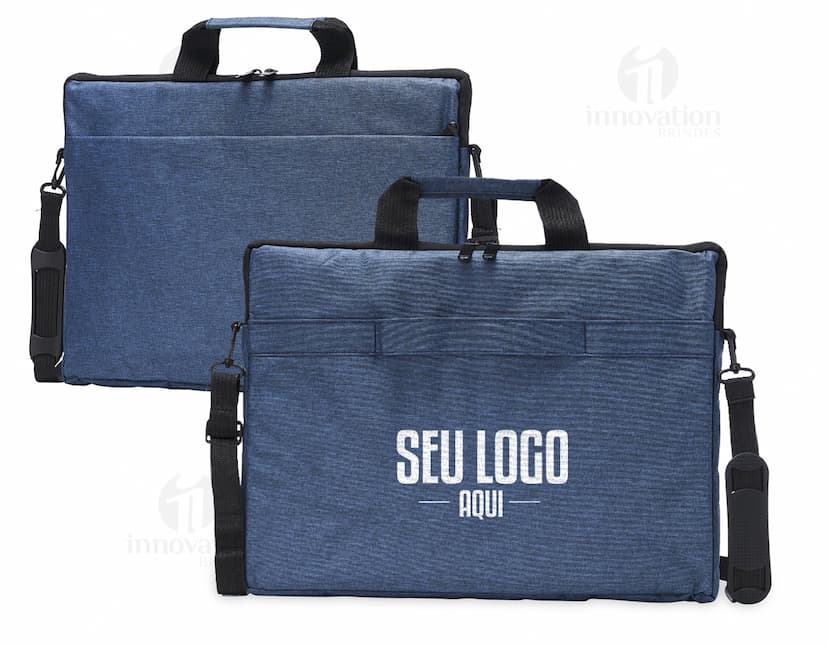 Mala de negócios em couro preto, com alça e fecho de metal. Perfeita para armazenar e transportar objetos pessoais, como notebooks de 15,6 polegadas. Elegante e moderna, ideal para viagens a trabalho ou compras.