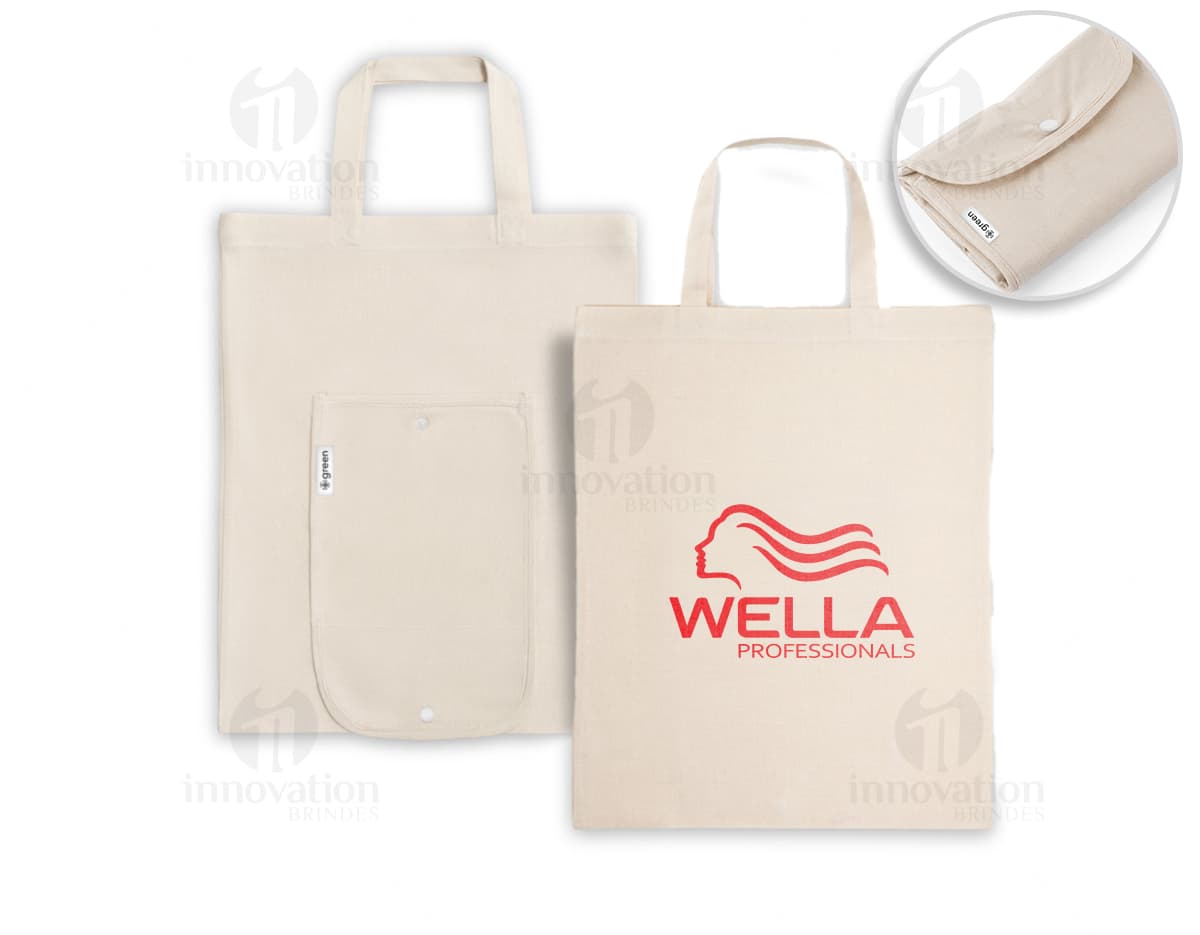 Bolsa de algodão reciclado dobrável, com design vintage. Feita de material eletrônico antigo, com espaço vazio para colocar documentos e objetos diversos. Cor marrom e amarela, com detalhes em plástico e metal. Ideal para uso no escritório, escola ou em viagens.