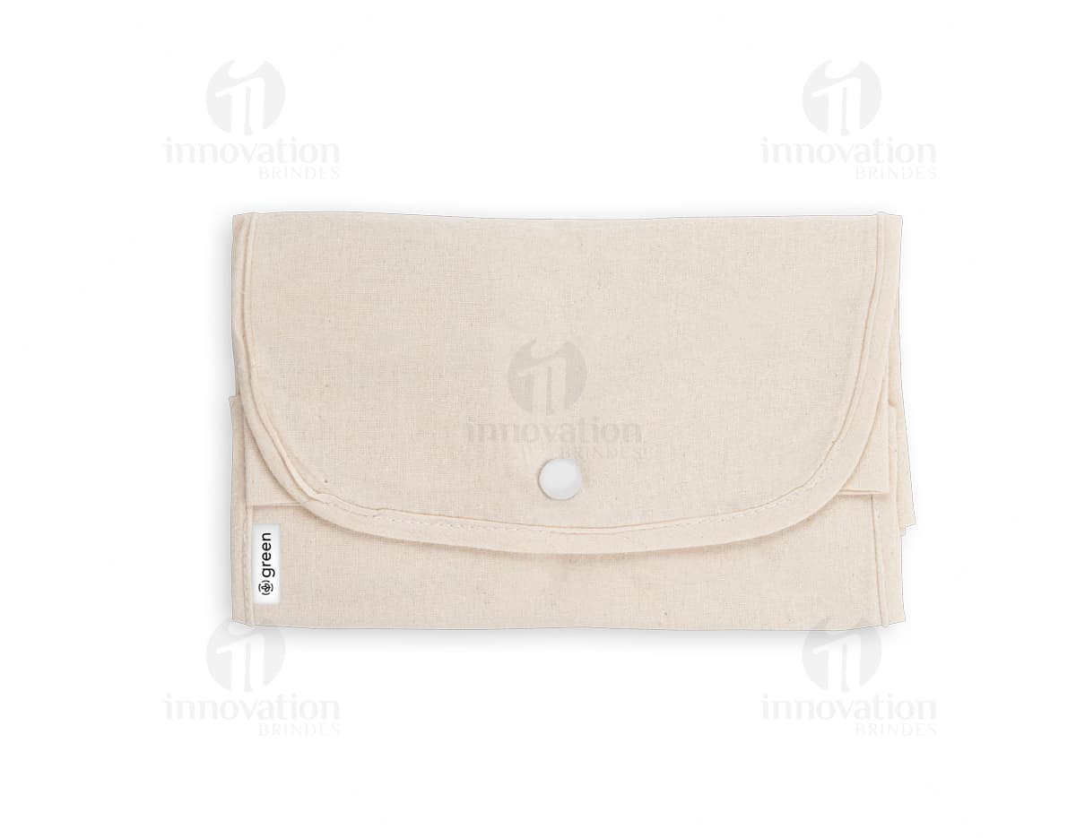 Bolsa de algodão reciclado dobrável, com design vintage. Feita de material eletrônico antigo, com espaço vazio para colocar documentos e objetos diversos. Cor marrom e amarela, com detalhes em plástico e metal. Ideal para uso no escritório, escola ou em viagens.