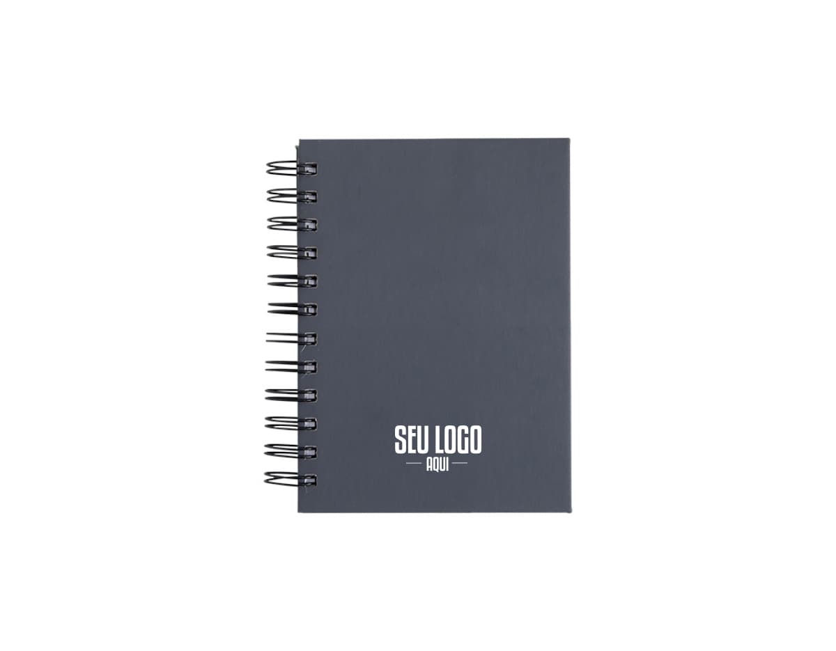 Agenda 2025 Emborrachada em uma mesa de escritório, ao lado de um notebook, dispositivo de internet, roteador, papel em branco, equipamentos de escritório e livros.