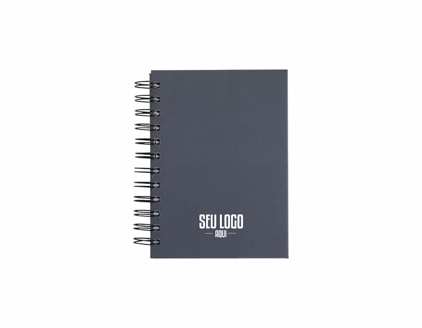 Agenda 2025 Emborrachada em uma mesa de escritório, ao lado de um notebook, dispositivo de internet, roteador, papel em branco, equipamentos de escritório e livros.