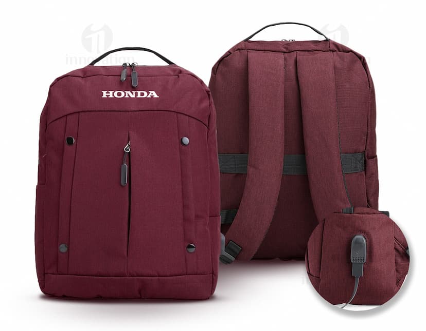 Mochila de nylon de 21 litros em marrom e preto, com alça de couro, zíperes, bolsos e tecido resistente. Ideal para viagens, uso casual e estilo moderno.