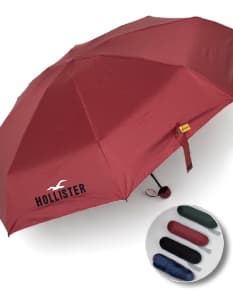 Guarda chuva com design moderno em preto e amarelo, com mapas e bandeiras de países impressos. Produto 3D com abertura automática, oferecendo proteção contra a chuva e vento. Item de segurança e conforto, ideal para uso em viagens de negócios ou lazer.