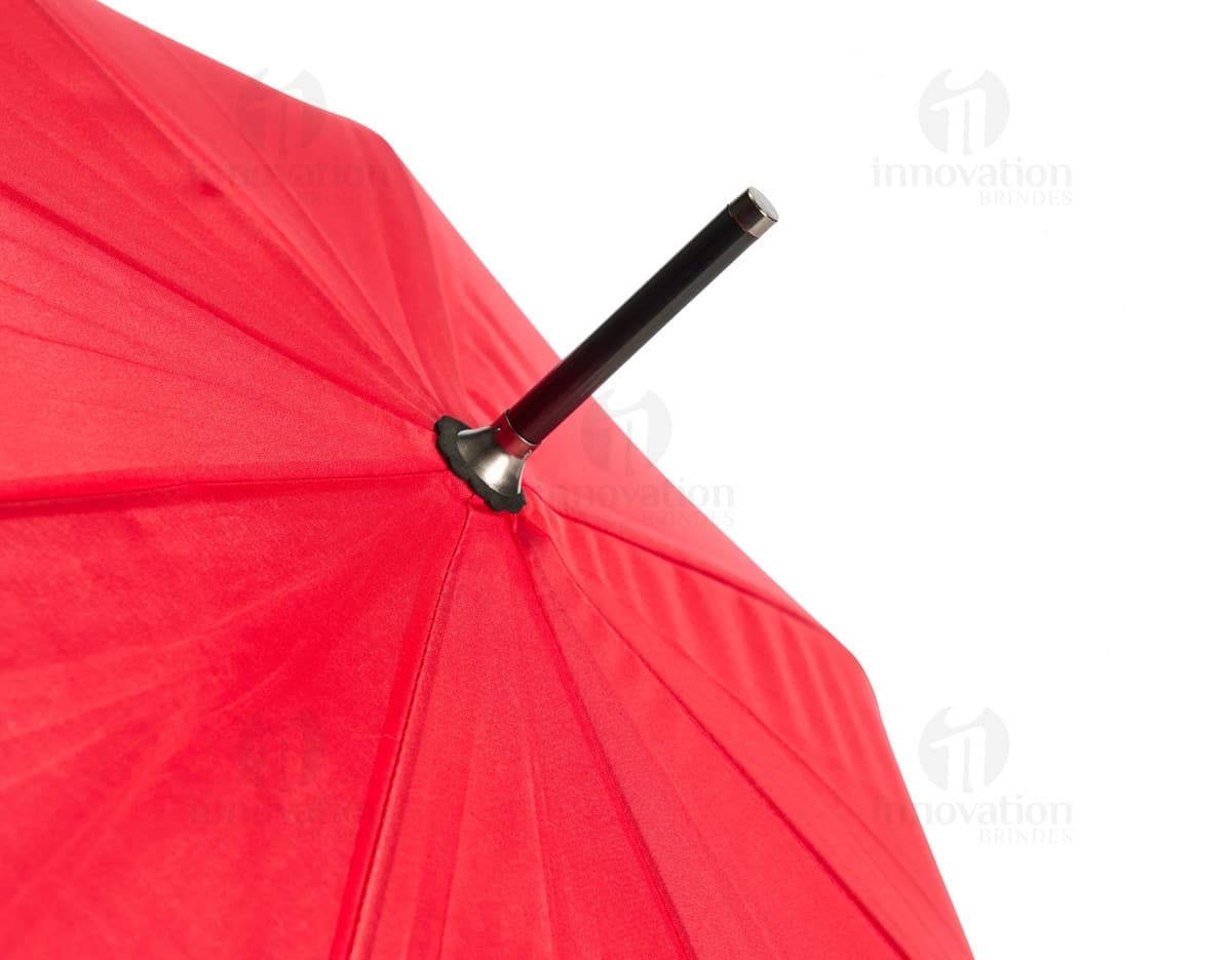 Guarda chuva automático em design moderno e colorido, com estampa de textura e padrão em tons de laranja, amarelo e preto. Possui cabo único e abertura automática, sendo um objeto artístico e criativo para proteção contra chuva e sol.