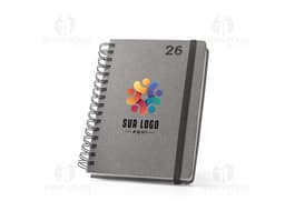 Ring binder planner for the year 2026, in black with gold details.