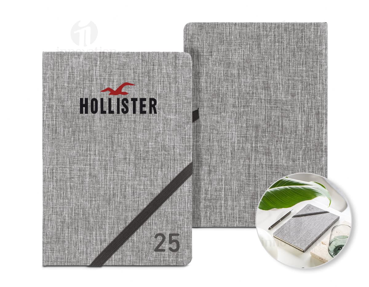 Agenda A5 300D PET reciclado com elástico, ideal para organização e anotações.