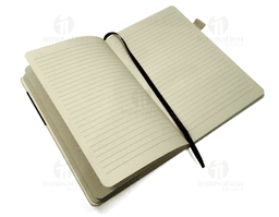 Brown leather notebook with visible stitching and button closure on the cover.