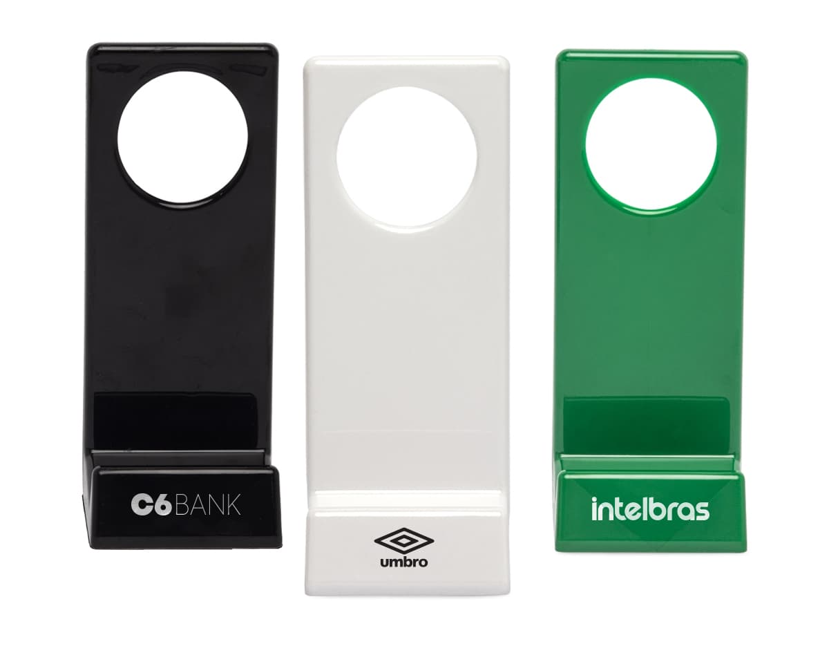 Suporte para celular moderno e brilhante com forma quadrada, feito de metal prateado e plástico brilhante. Possui teclado e botões de acesso rápido, refletindo a tecnologia de design 3D. Ideal para uso em escola, negócios ou comunicação.
