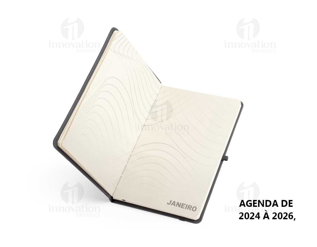Planner Cromato Anual com capa azul, contendo páginas mensais e semanais com espaço para anotações e planejamento.