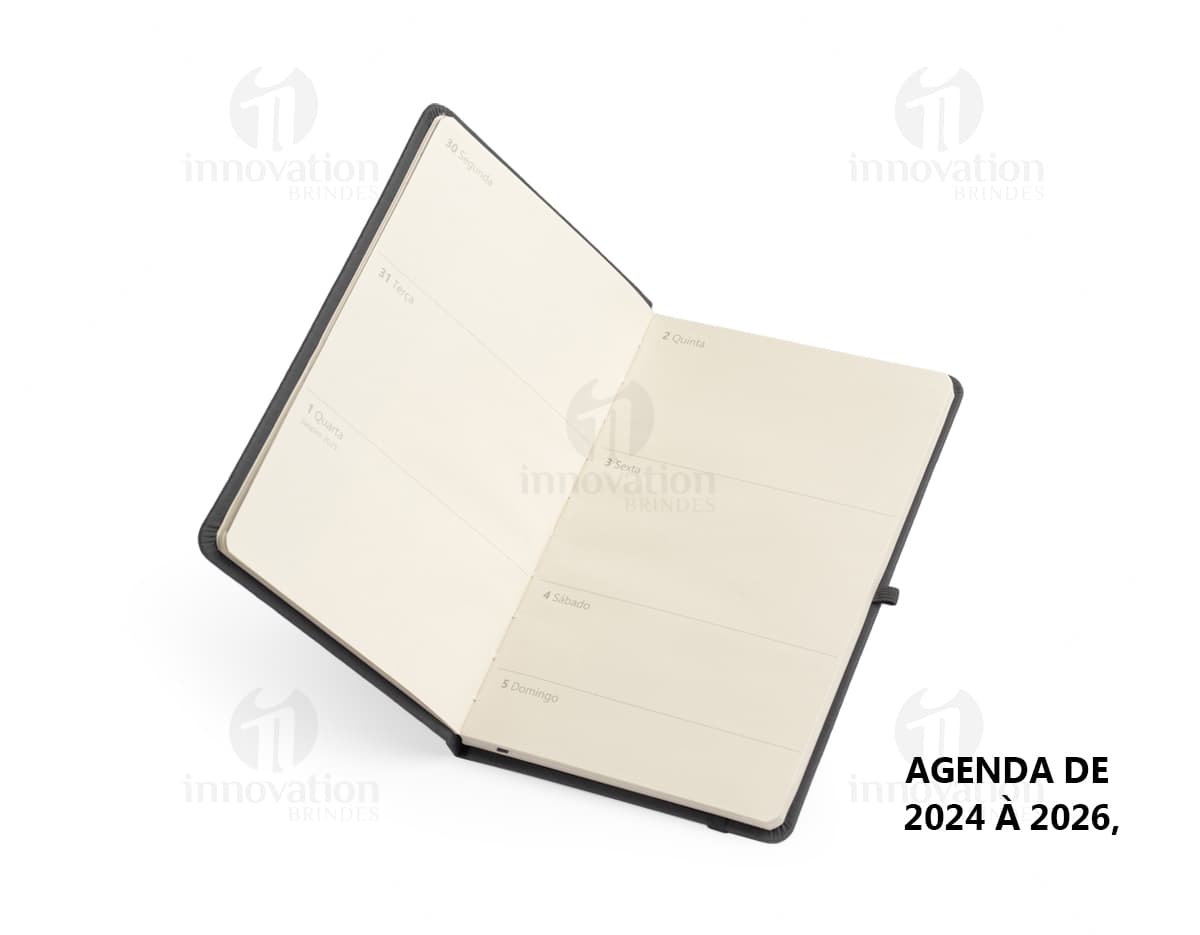 Planner Cromato Anual com capa azul, contendo páginas mensais e semanais com espaço para anotações e planejamento.