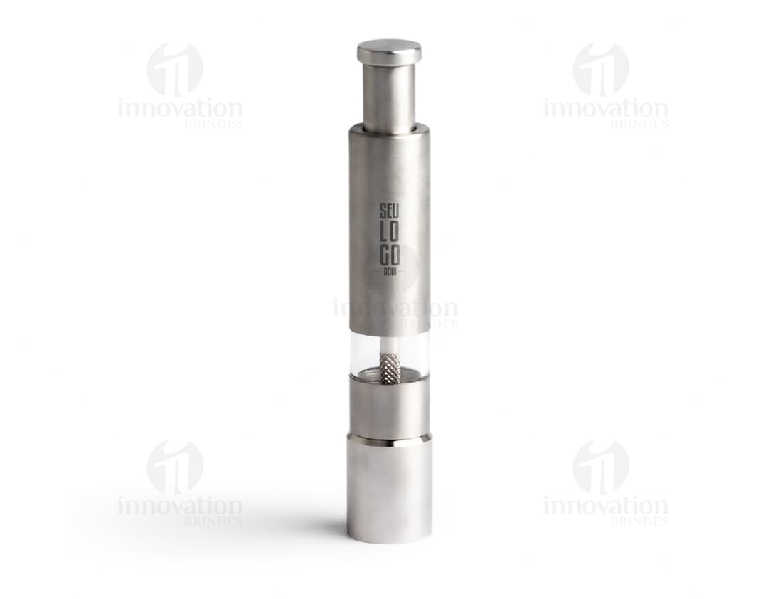Triturador de tempero feito de metal prateado, com design moderno e tecnológico. O dispositivo possui um recipiente de