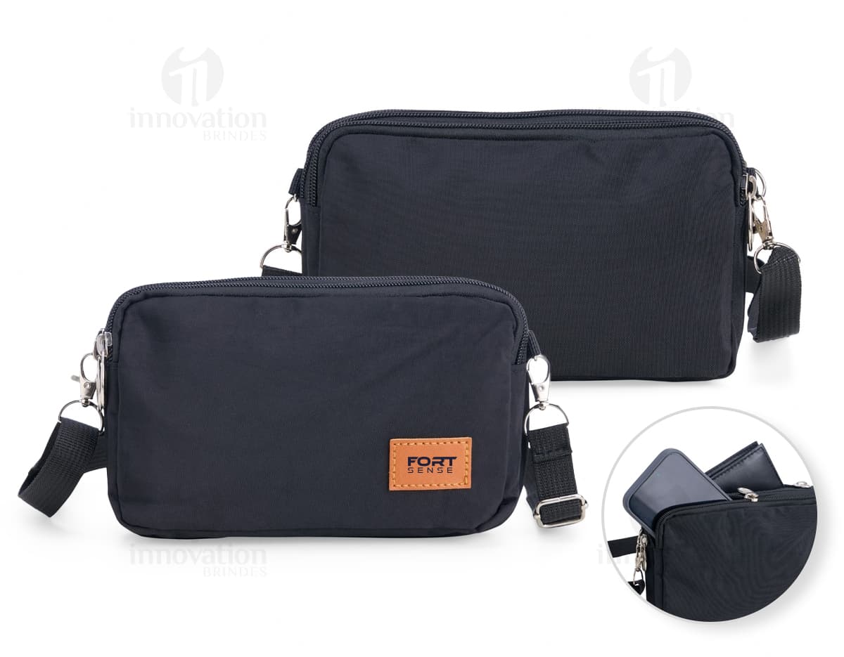Mini Bolsa Transversal de Nylon preta, ideal para viagens e negócios. Possui alça ajustável, fecho em zíper e design moderno e elegante. Ótima opção para transporte de dinheiro e objetos pessoais com segurança.
