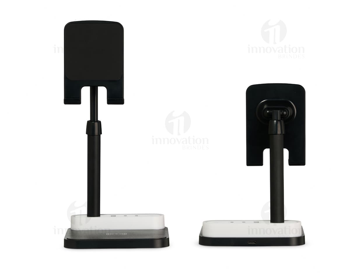 Base de Carregamento para dispositivos eletrônicos, como computador, laptop, celular e tablet. Equipamento moderno e tecnológico com conexão wireless, ideal para carregar diversos aparelhos ao mesmo tempo. Estação de carregamento com design elegante em preto e prata, perfeito para uso em escritórios e em casa.