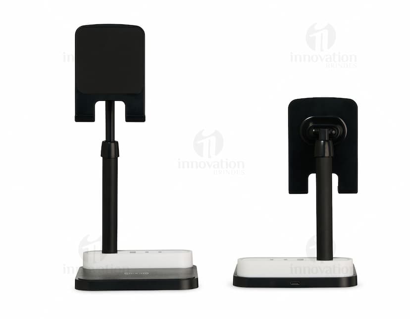 Base de Carregamento para dispositivos eletrônicos, como computador, laptop, celular e tablet. Equipamento moderno e tecnológico com conexão wireless, ideal para carregar diversos aparelhos ao mesmo tempo. Estação de carregamento com design elegante em preto e prata, perfeito para uso em escritórios e em casa.