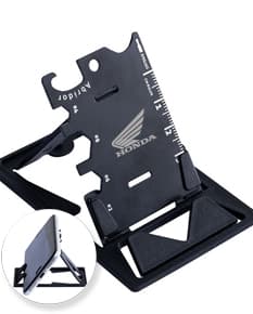 Suporte para smartphone preto em formato de suporte de mesa, permitindo o ajuste de angulação e altura do aparelho.