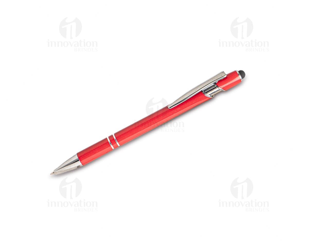 Caneta metal touch em diversas cores sobre uma mesa de escritório, ao lado de um bloco de notas, lápis e papel.