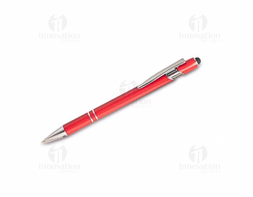 Caneta metal touch em diversas cores sobre uma mesa de escritório, ao lado de um bloco de notas, lápis e papel.