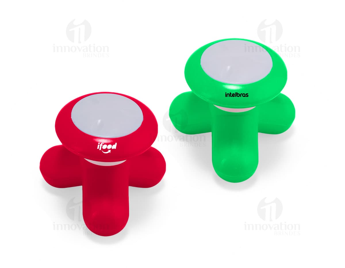 Mini Massageador Corporal em forma de bastão, cor branca com detalhes em rosa. Possui cabeça massageadora e botão de ligar/desligar na parte superior. Ideal para relaxar e aliviar tensões musculares.