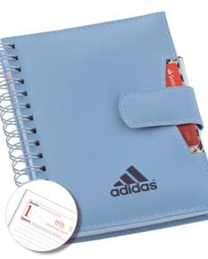 Agenda Wire-o com capa azul, espaço para anotações e espiral na lateral.