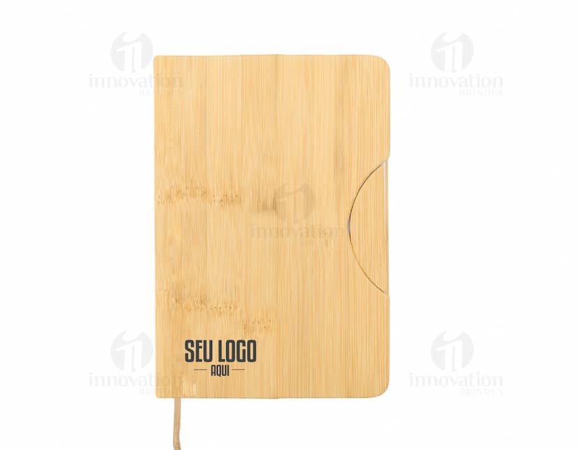 Caderneta com suporte para celular em cor rosa com elástico para prender o celular na capa frontal.