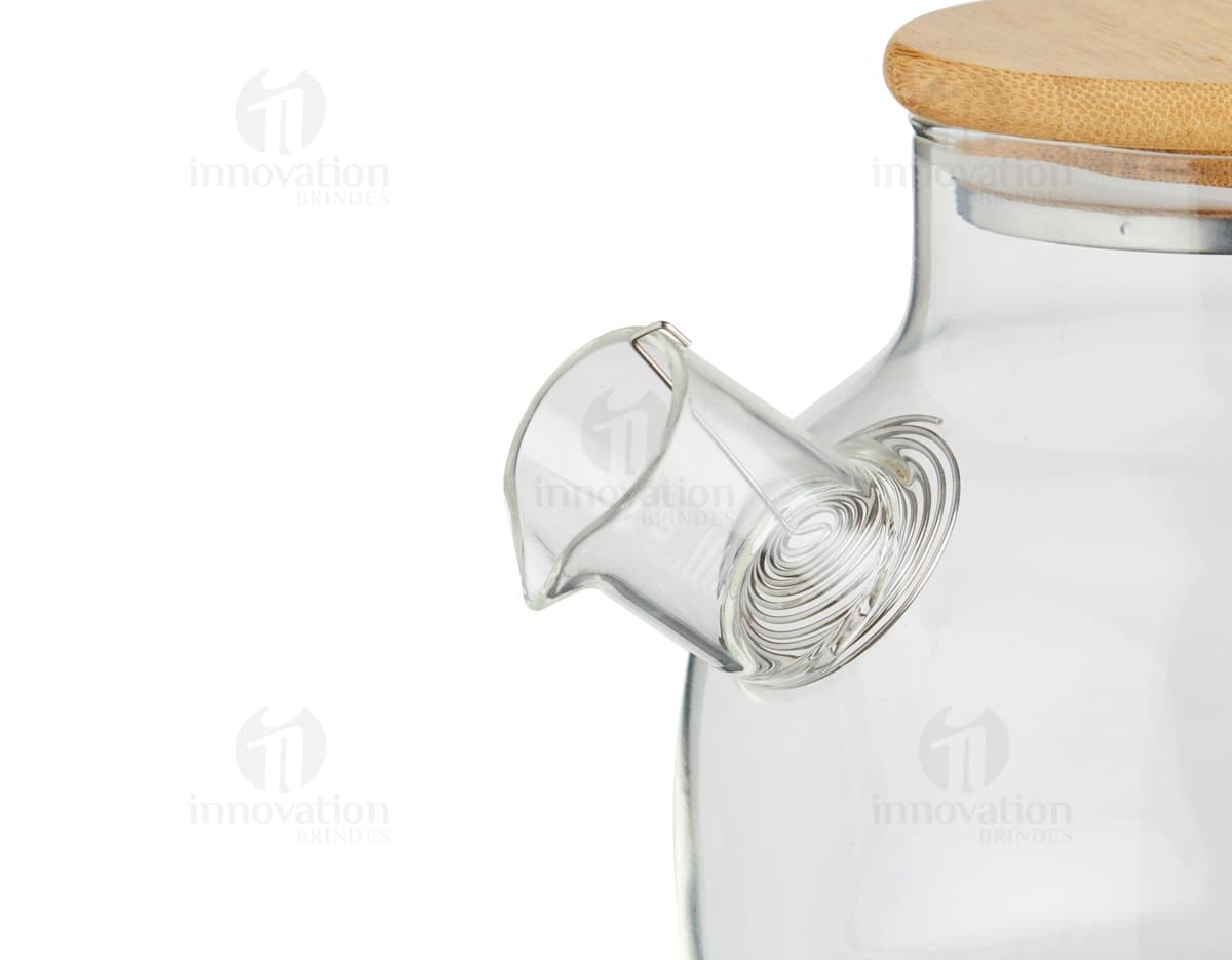 Chaleira de Vidro 800ml transparente com tampa de metal e alça de plástico preto em fundo branco.