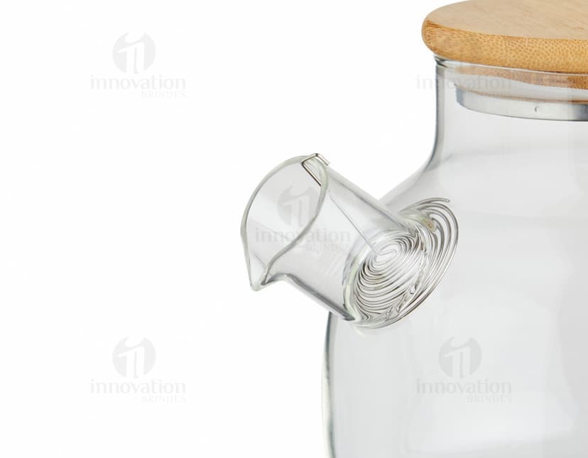 Chaleira de Vidro 800ml transparente com tampa de metal e alça de plástico preto em fundo branco.