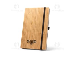 Cuaderno de bolsillo negro con tapa de cuero y elástico de cierre.