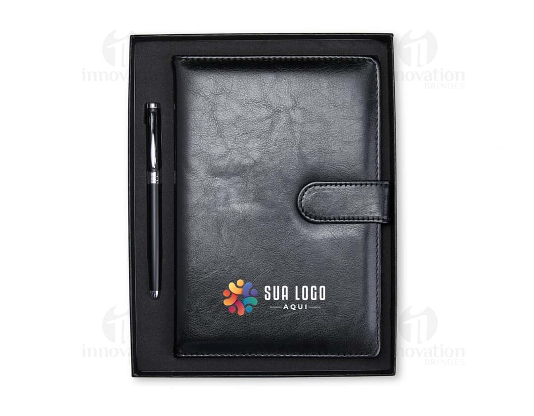 Kit Ejecutivo 2 Piezas: incluye una carpeta de cuero marrón y un bolígrafo de lujo plateado.