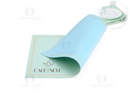 Double-Sided Placemats in shades of blue and green, featuring leaf and stripe patterns.