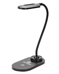 Luminária Led Carregamento via Indução em uma mesa branca, iluminando o ambiente de forma suave e eficiente.