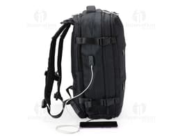 Black 41-liter travel backpack made of synthetic leather with zipper, hand strap, and adjustable shoulder strap. Ideal for