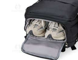 Black 41-liter travel backpack made of synthetic leather with zipper, hand strap, and adjustable shoulder strap. Ideal for